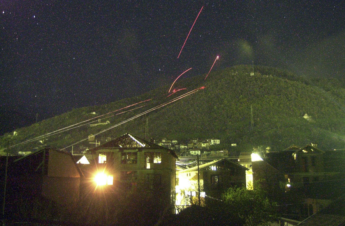 Tracer rounds light up the sky above Tetovo during  a nightly exchange of fire.