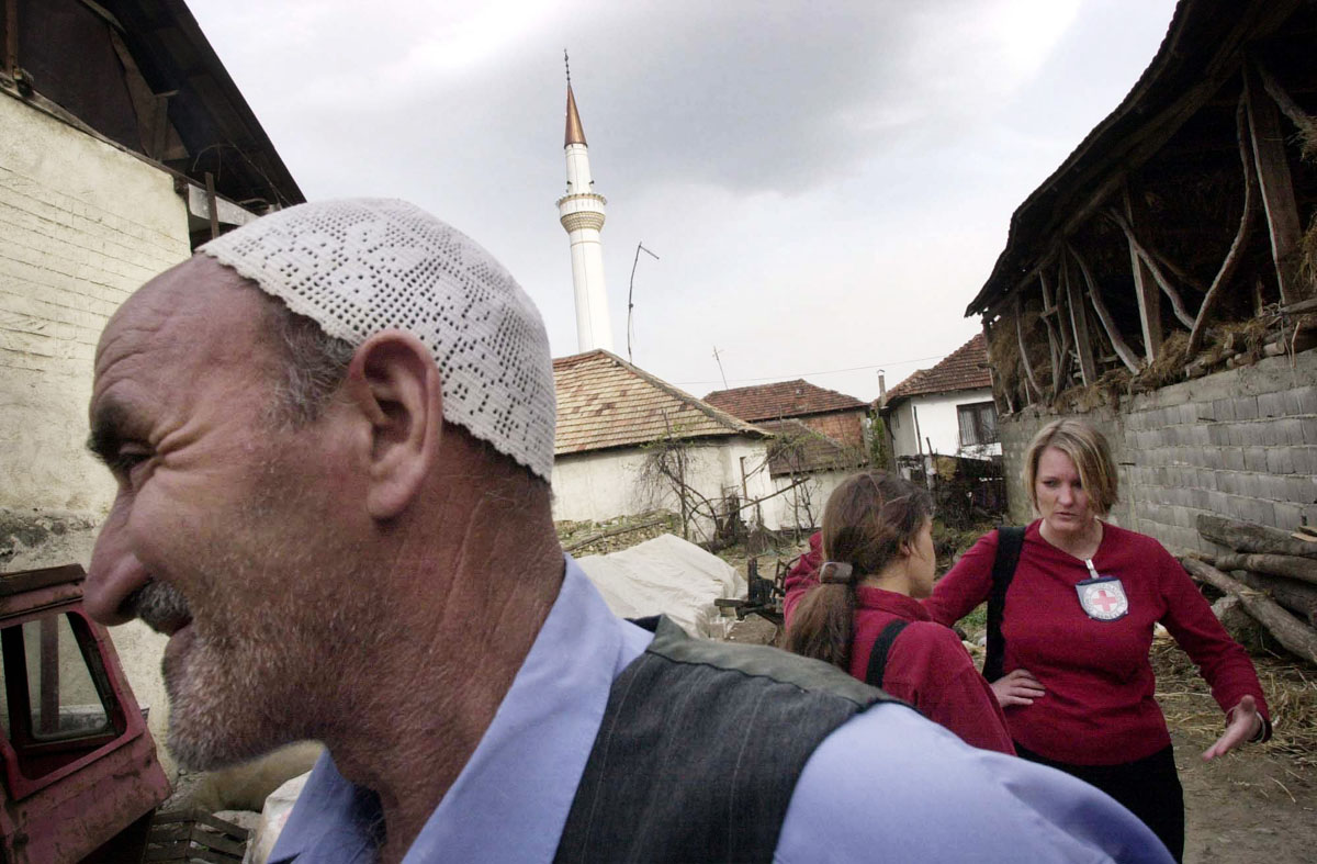 Members of the Red Cross visit refugees fleeing the fighting in villages around Tetovo.